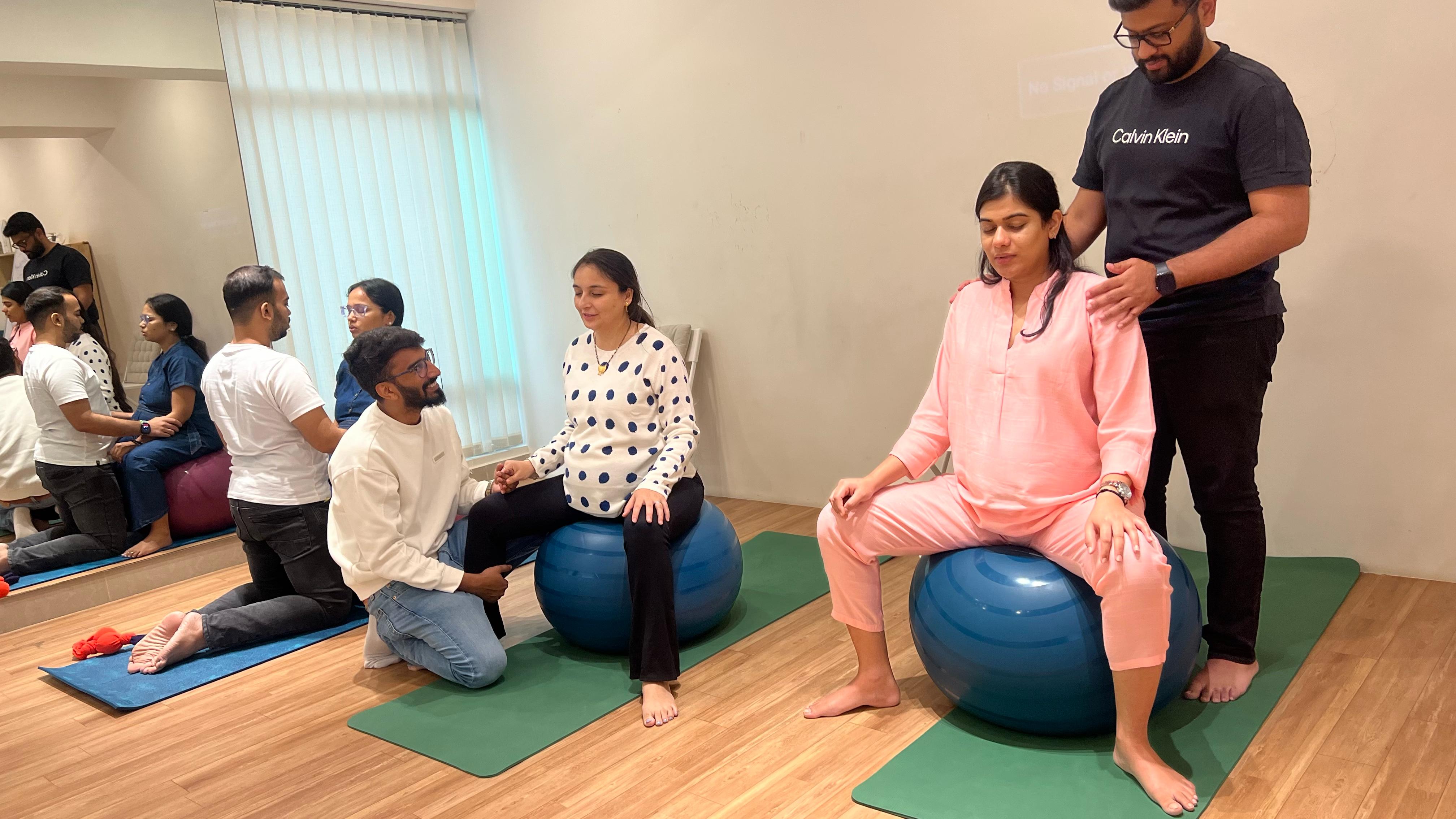 Interactive session at Aura's labor management workshop - Participants engaged in learning techniques to cope with labor pain and support during childbirth